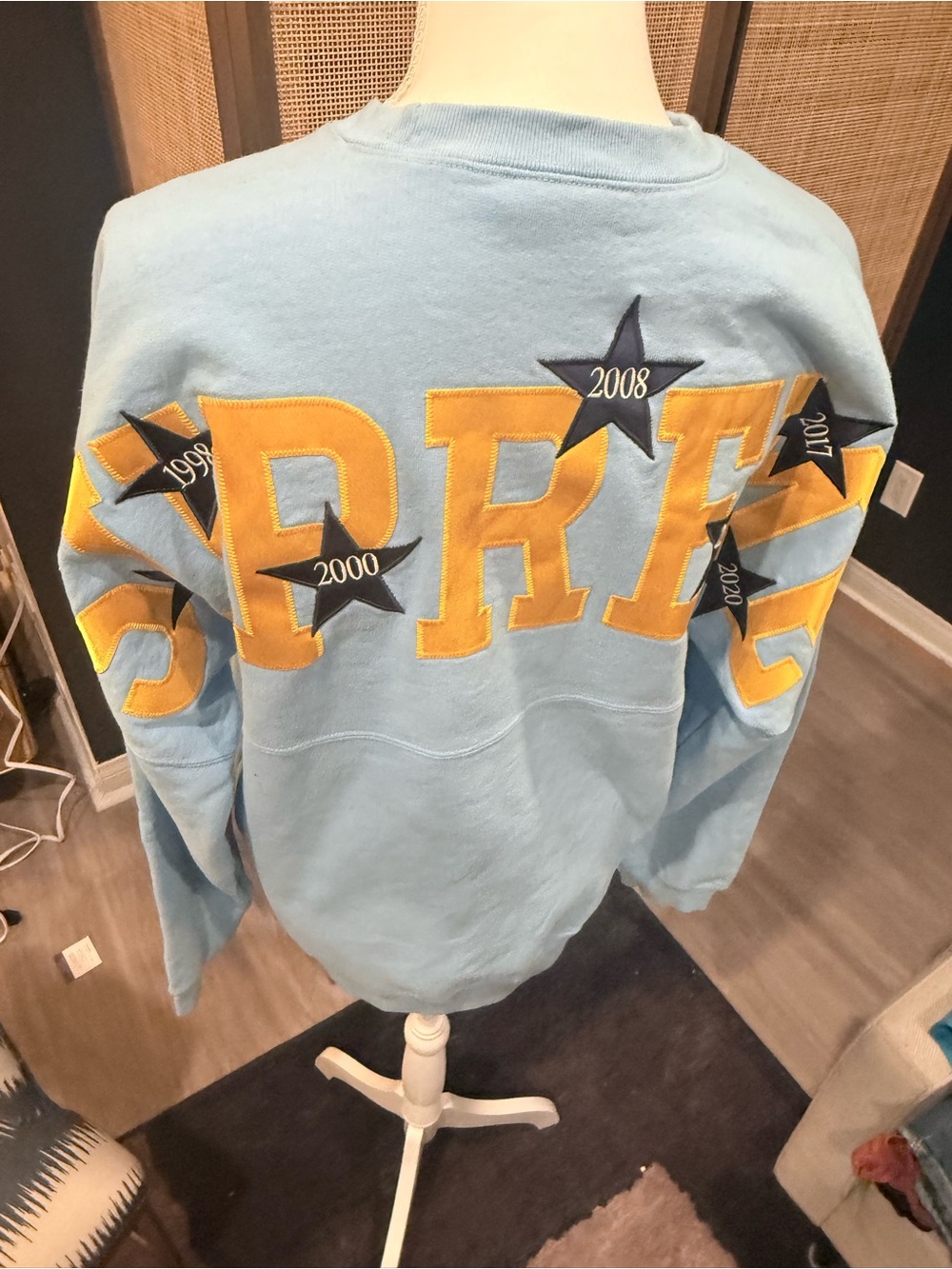 Supreme Light Blue Sweatshirt with Yellow Lettering and Star Accents - Size M